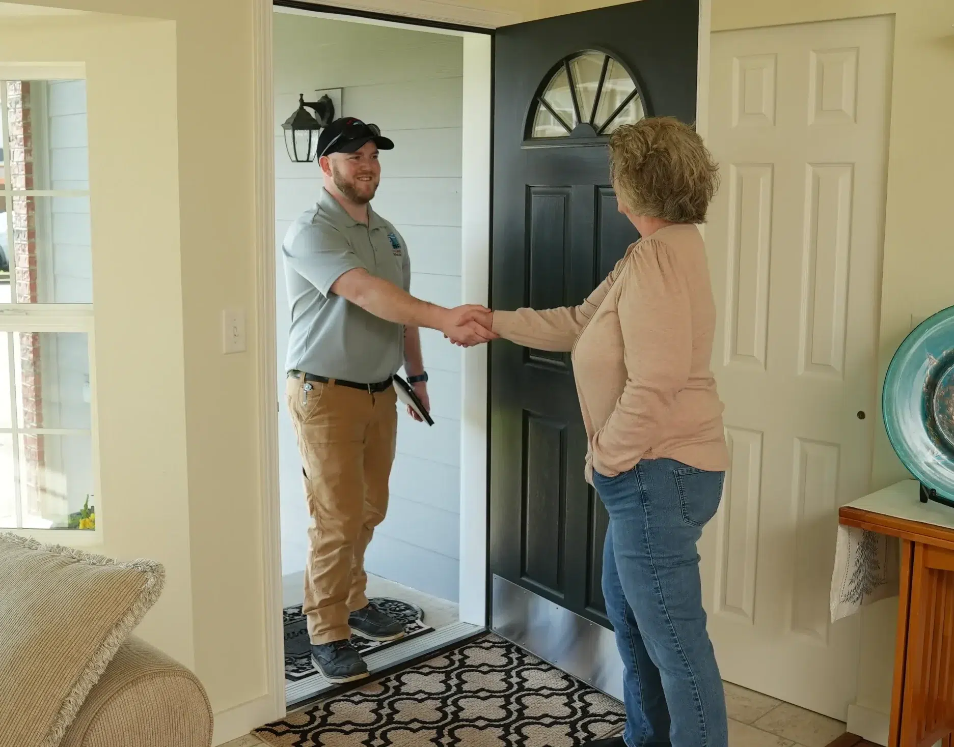 Tech and homeowner shaking hands
